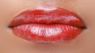 Image of lips with red lip gloss